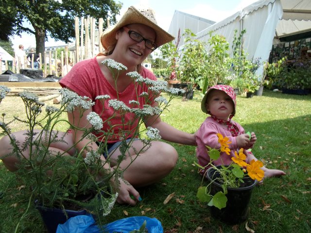 Clare and her little helper tidying up the plants